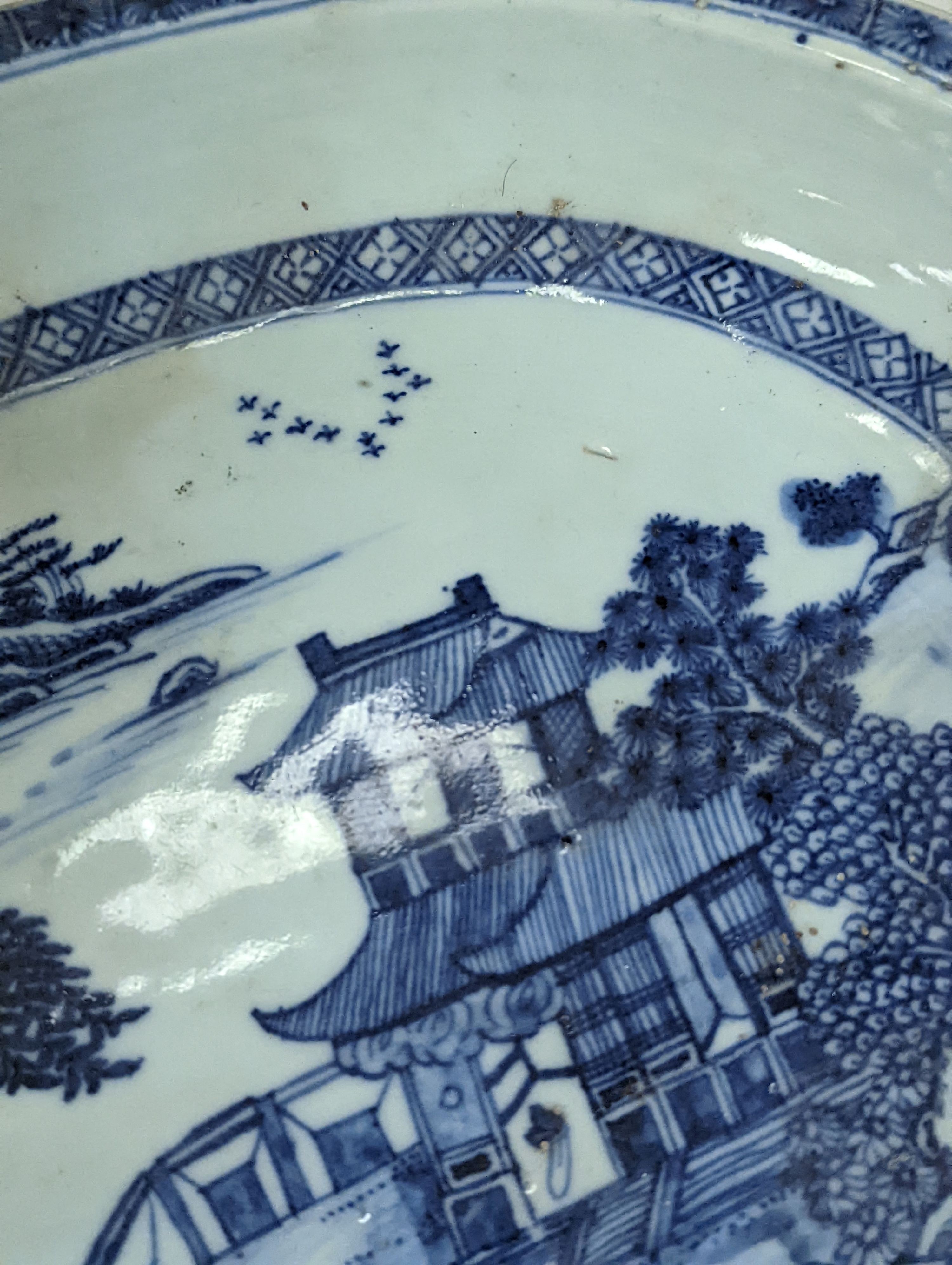 An 18th century Chinese export oval blue and white dish, 32cm.